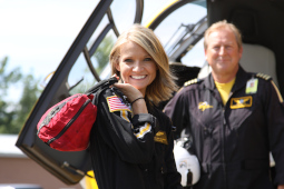 A PHI flight nurse poses in front of one of our air medical helicopters.